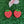 Load image into Gallery viewer, two red plastic strawberries with white polka dots placed on a green surface.
