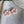 Load image into Gallery viewer, a close-up view of a book with pink flower-shaped earrings resting on the pages.
