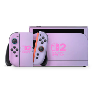 a Nintendo Switch 2 console and its accompanying controllers, which are both in a light purple color.
