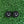 Load image into Gallery viewer, two black circles with white smiley faces on a green surface.
