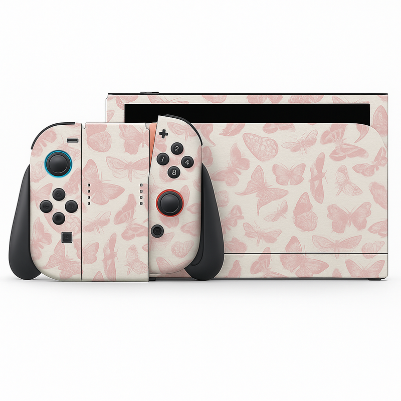 a Nintendo Wii console with a pink and white butterfly pattern skin. The console has two black and red buttons, and the two controllers are positioned next to each other.