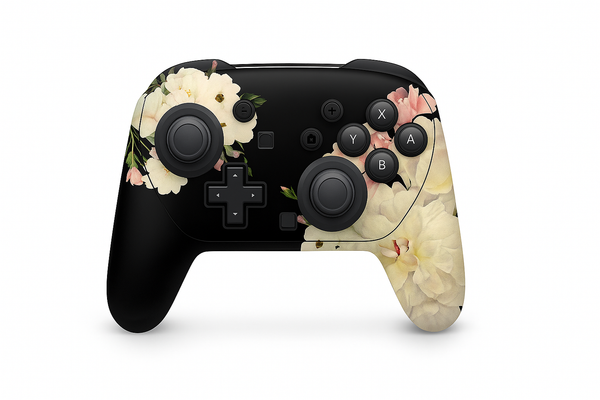 A black and white game controller with a floral design on the buttons and a flower-like pattern on the grip.